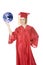 Caucasian teenager wearing a graduation gown holding the earth