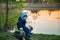 Caucasian toddle boy outdoors near lake in spring