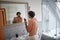 Caucasian topless man shaving with shaver