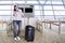 Caucasian tourist with a smartphone at airport