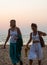 Caucasian Tourists and families relaxing and enjoying on the beach at Agonda Beach in Goa, India