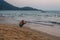 Caucasian Tourists and families relaxing and enjoying on the beach at Agonda Beach in Goa, India