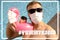 Caucasian white male near to a swimming pool with a toy flamingo in a medical face mask.