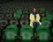 Caucasian woman cheers for a sports team at the stadium. The girl watches the match at the stadium alone.