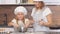 Caucasian woman and child girl together in kitchen