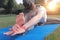 Caucasian Woman doing sport stretching exercises in park