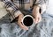 Caucasian woman drinks coffee in the morning