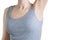 Caucasian woman in a gray sleeveless t-shirt with smoothly shaved armpit. White isolate