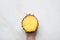 Caucasian Woman Holding in Hand Sliced Ripe Juicy Pineapple on White Marble Table. Top View Flat Lay. Summer Healthy Lifestyle