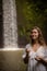 Caucasian woman keeping count during pray and meditation. Buddhist japa mala. Strands of gemstones beads. Religion concept.