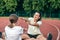 Caucasian woman and little girl are engaged in fitness at the stadium.