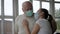 Caucasian Woman In Medical Mask Hugging Old Man Father Supporting And Caring Him