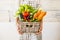 Caucasian woman people with bucket full of coloured and mixed fresh healthy food like fruit and vegetables