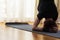 Caucasian Woman Practicing Yoga Exercise Indoors At Bright Afternoon. Sitting in Shirshasana Pose During Solitude Meditation