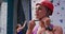 Caucasian woman putting on helmet before a climb at indoor climbing wall