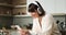 Caucasian Woman Texting on Phone and Smiling in the Kitchen