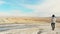 caucasian woman walks on mud volcanoes. Travel destination in Georgia - Chachuna managed reserve