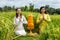 Caucasian women dressed in traditional Balinese costumes praying. Hands in namaste mudra. Religious ceremony. Hindu religion.