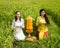 Caucasian women dressed in traditional Balinese costumes praying using offerings. Hindu religious ceremony. Culture and religion.