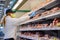 Caucasian women in protective mask shopping in supermarket during coronavirus pneumonia outbreak. Coronavirus, health protection