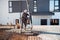 Caucasian workers pouring concrete with concrete pump.