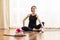 Caucasian Yoga Woman Blurred on Background. Sport Accessories in Foreground In Focus