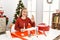 Caucasian young blonde woman doing christmas handcraft creative decoration doing ok sign with fingers, smiling friendly gesturing