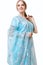 Caucasian young woman in blue indian national dress isolated