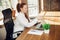 Caucasian young woman in business attire working in office