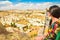 Caucasian young woman tourist on viewpoint stand and watch beautiful landscape of Cappadocia. Travel holidays in Turkey