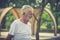 Caucasion elderly man smiling with happy and walking in public park