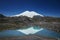 Caucasus Elbrus majestic mountain peak, blue sky lake, snow covered glacier, rocky landscape, alpine scenery