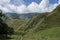 Caucasus mountains, canyon of Argun. Road to Shatili with ancient watchtower and cows, Gorgia