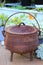 A Cauldron, three-legged pot, for cooking food slowly over an open fire.