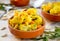 Cauliflower curry with pumpkin, paprika and arugula