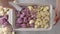 Cauliflower florets, white and purple, close-up in baking pan