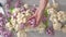 Cauliflower florets, white and purple, close-up on cutting board