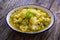 Cauliflower soup on wooden table background