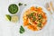 Cauliflower steak with sweet potato mash, above view scene on a marble background