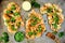 Cauliflower steaks top view on a rustic baking tray, healthy plant based meat substitute concept