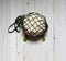 Cauliflower in a string bag on a light background, image of a sheep