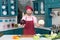 Cauliflower vs red cabbage to choose by chef. Man shows big Cauliflower and red cabbage before preparing and cutting for salad.