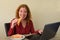 Causasian woman enjoying breakfast or lunch while working or learning at home