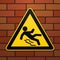Caution - danger Beware of slippery. Safety sign. The triangular sign on a brick wall. Industrial design. Vector