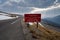 Caution - dangerous snowfields ahead sign, keep off steep slopes along Trail Ridge Road in Rocky Mountain National Park Colorado