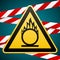 Caution oxidizer. Safety sign. Yellow triangle with black image on the background of protective tape. Signs and symbols