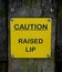 Caution Raised Lip Sign at a Canal Lock Gate