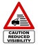 Caution reduced visibility, fog area. Triangle road warning sign.