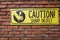 Caution Sign On Brick Wall,Beware Sharp Object