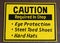 Caution Sign requiring eye protection, steel toes and hard hats in shop area